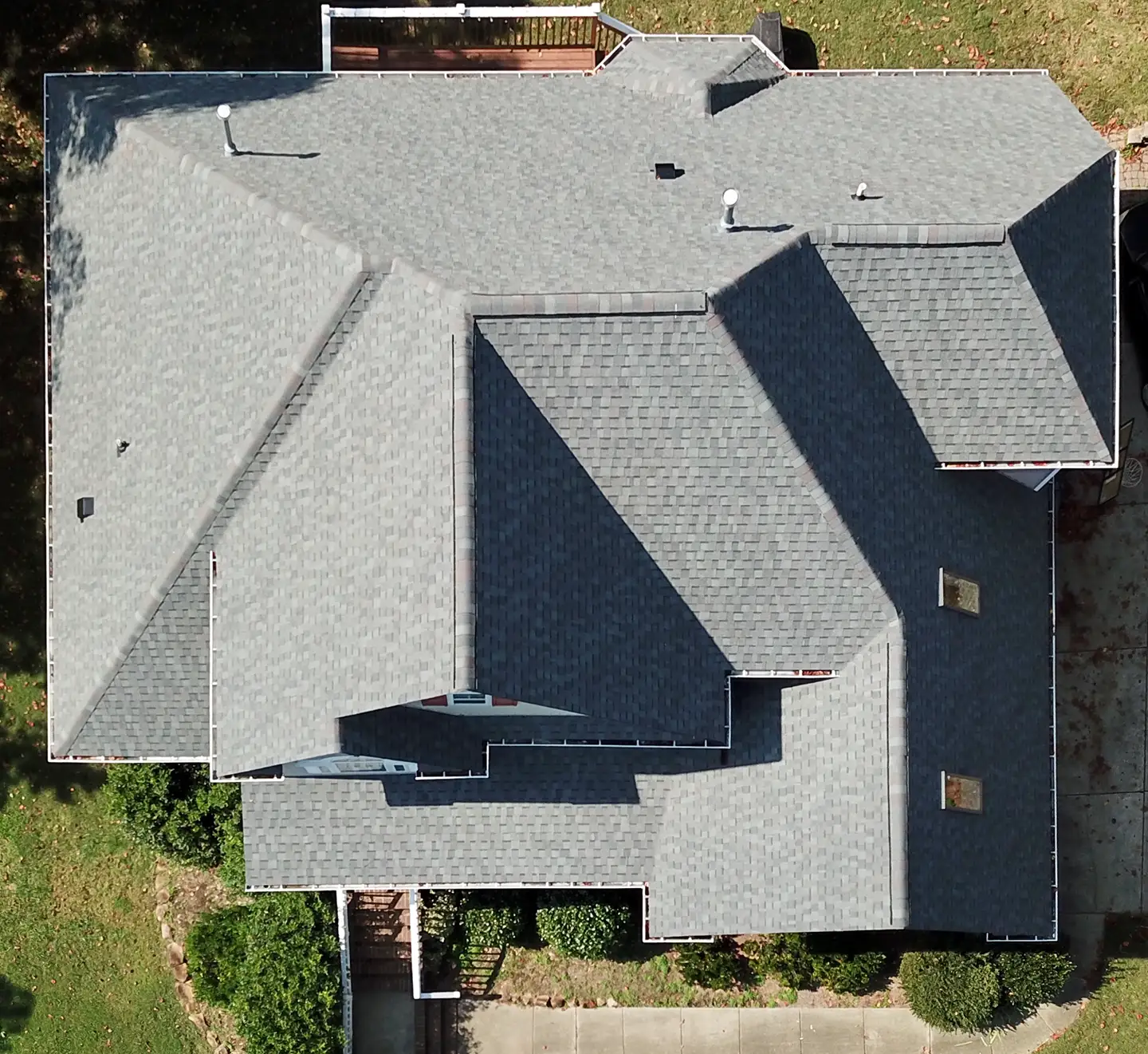 Aerial top-down view of a completed shingle roof by Redeem Roofing